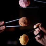 Chopsticks holding food